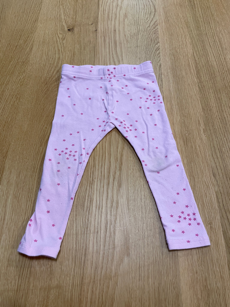 Legging rose avec étoiles, tâche sur le genou gauche